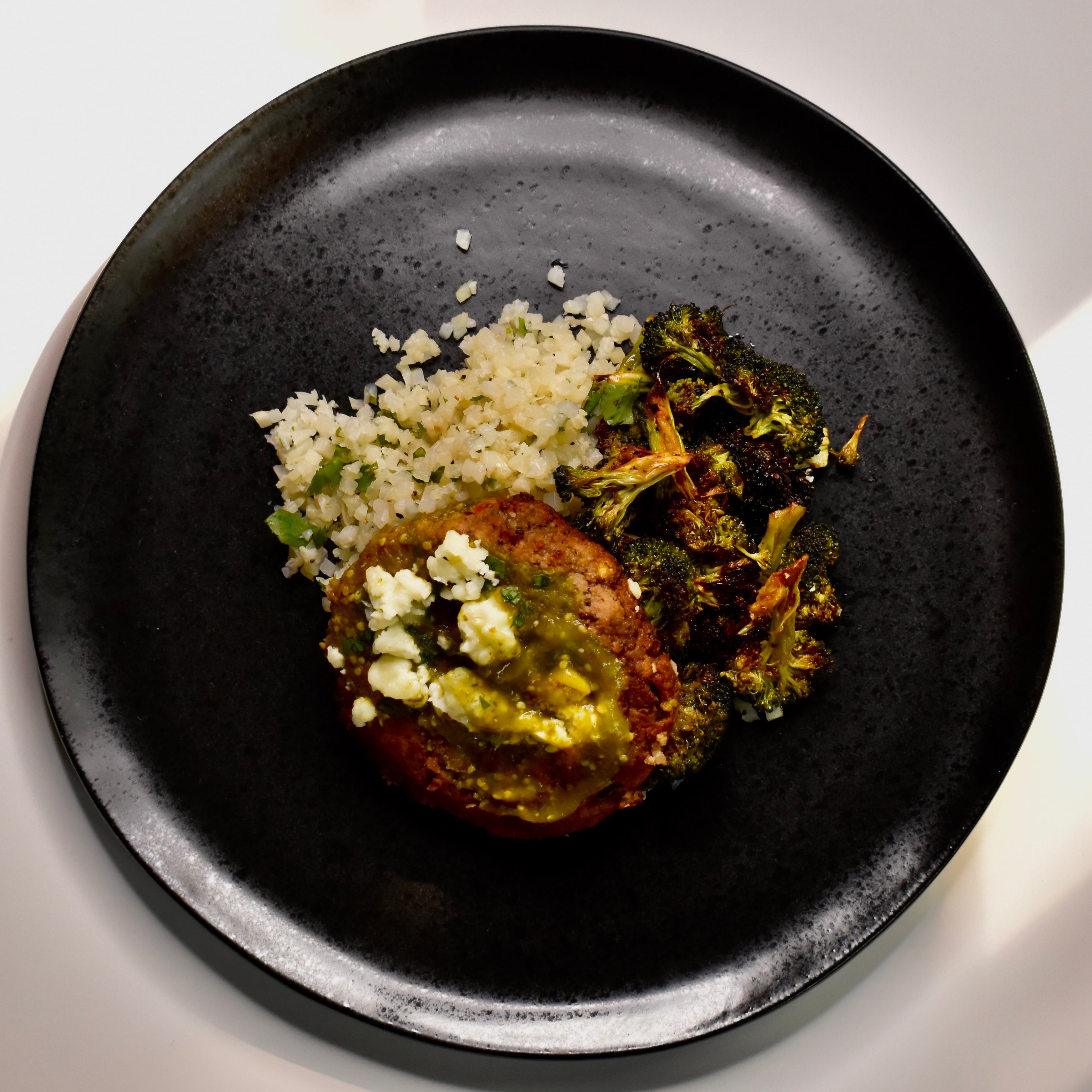 Black Bean & Corn Cake with Salsa Verde, Cotija Cheese, Cilantro-Lime Cauliflower Rice, Smoked Paprika Broccoli