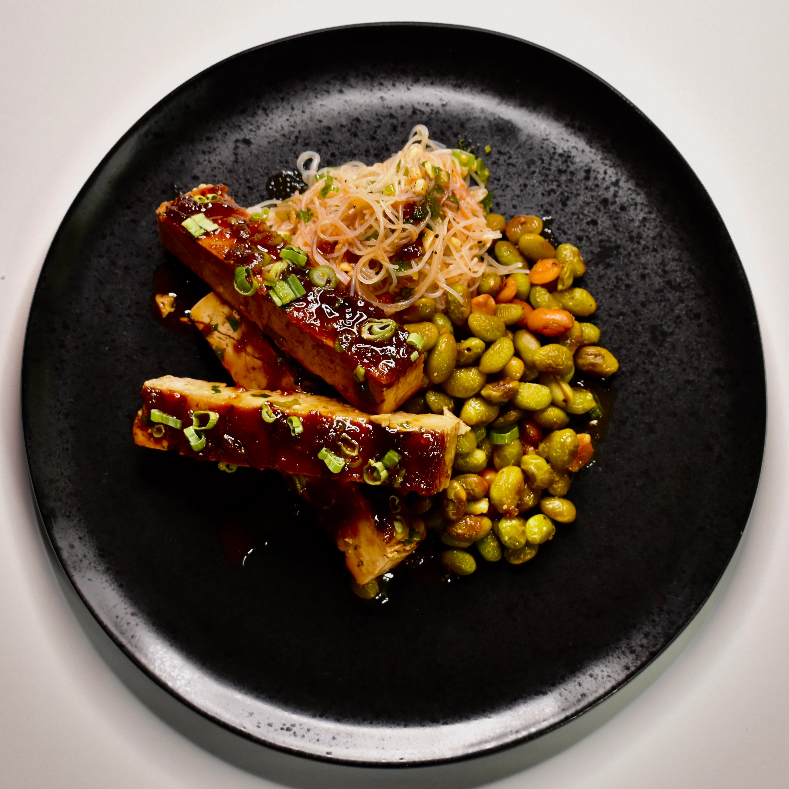 Sticky Asian BBQ Tofu with Ginger Rice Noodles and Peanut Roasted Edamame
