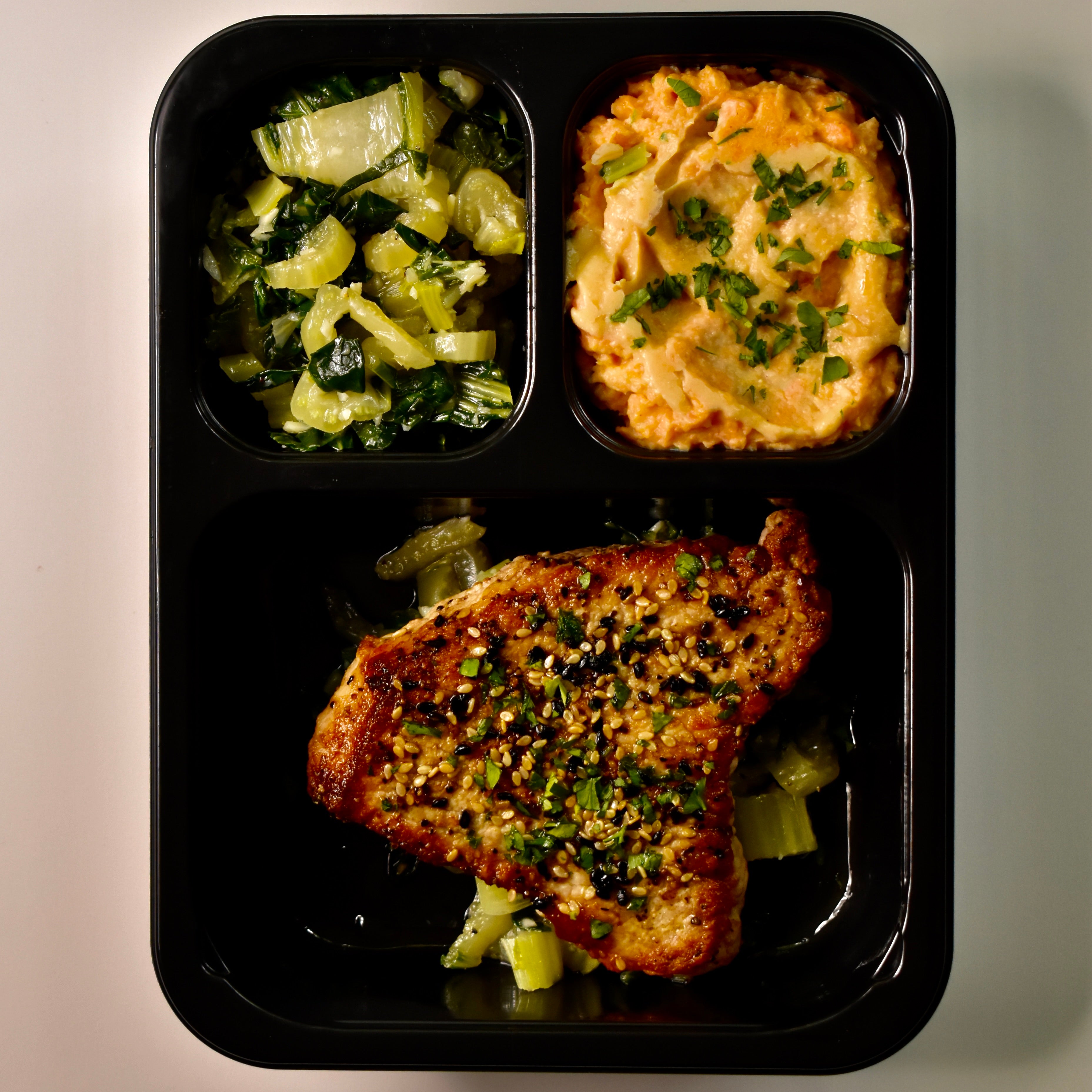 Sesame Crusted Boneless Pork Chop with Roasted Garlic Bok Choy and Sweet Potatoes w/ Miso Butter