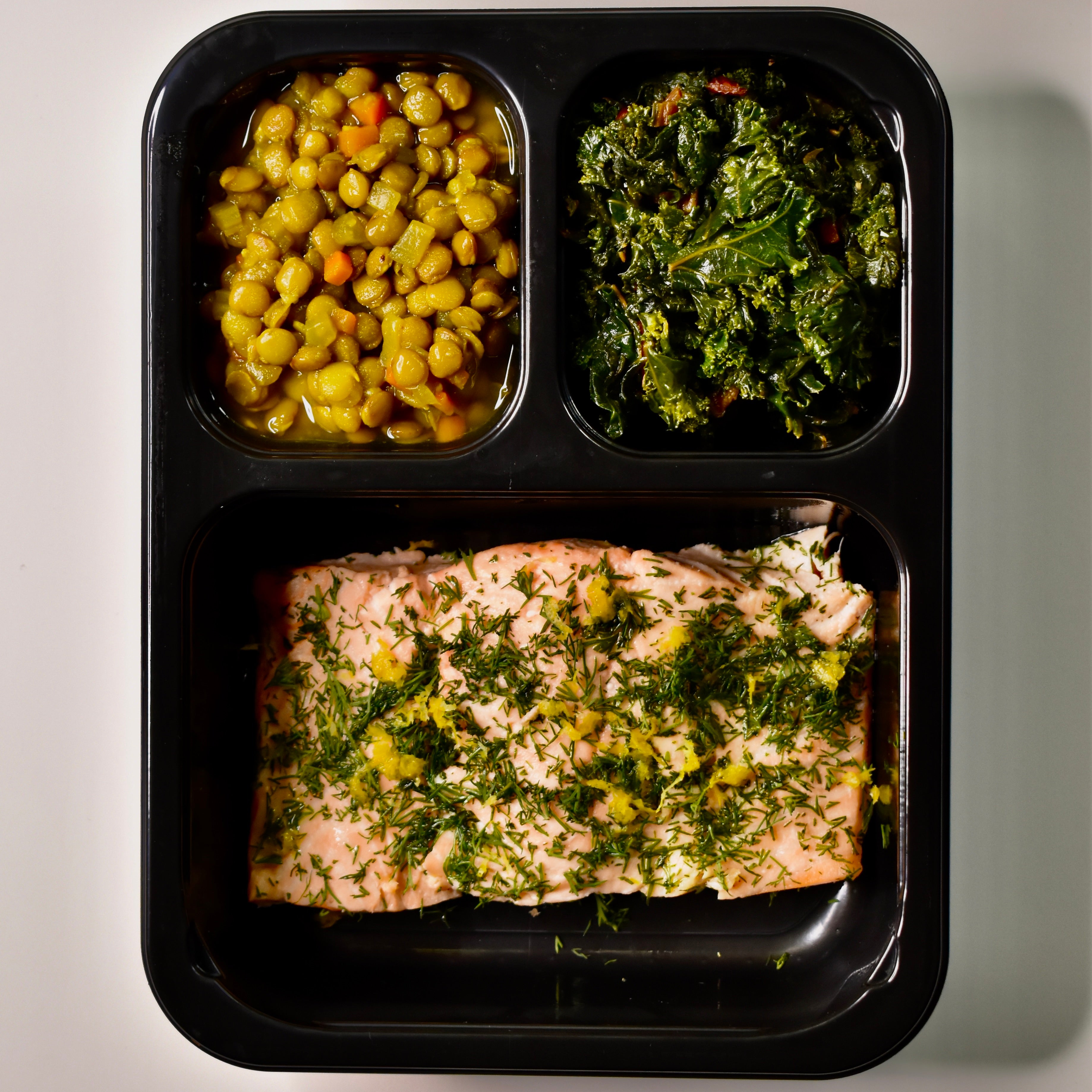 Lemon Poached Atlantic Salmon with Braised Turmeric Lentils and Roasted Garlic Kale