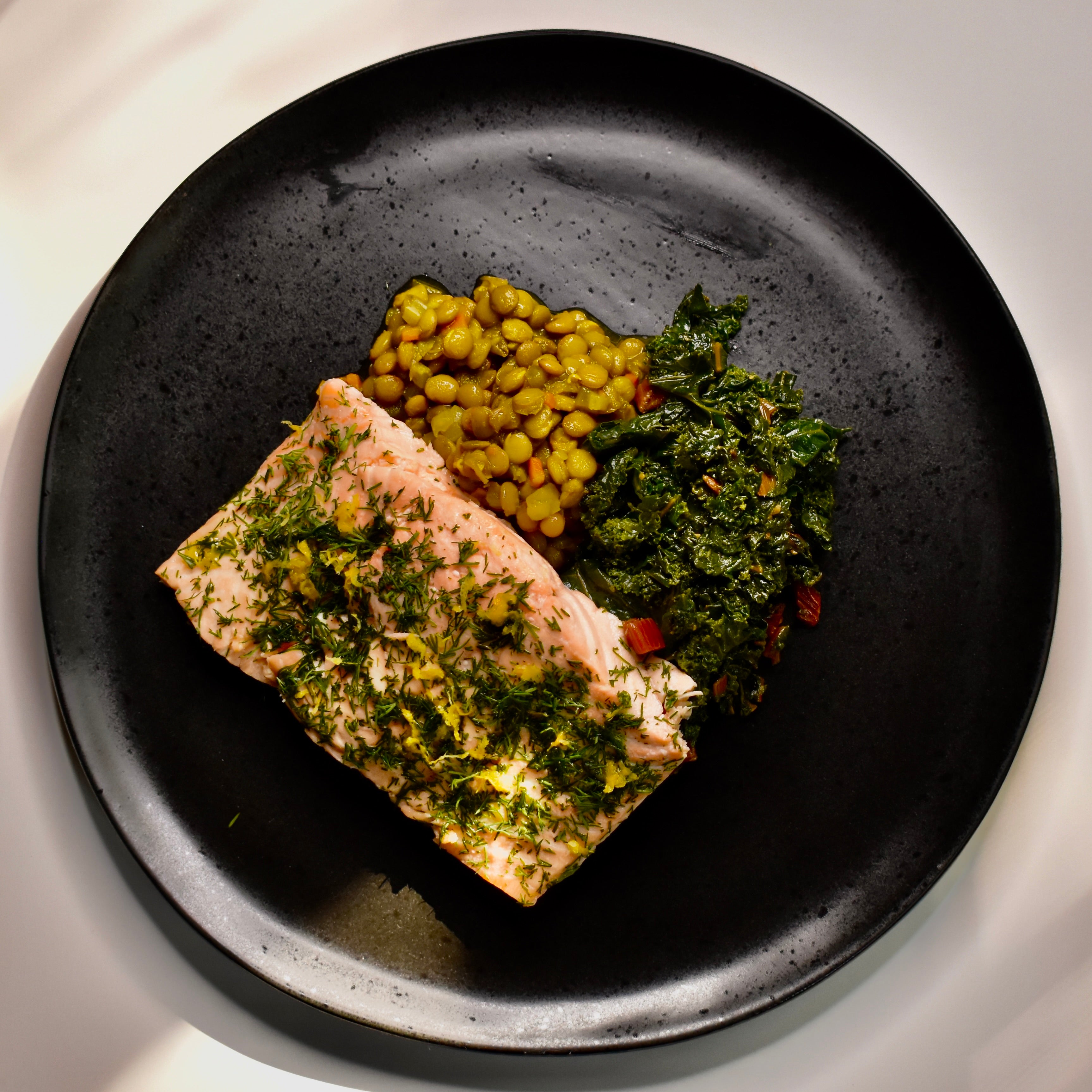 Lemon Poached Atlantic Salmon with Braised Turmeric Lentils and Roasted Garlic Kale
